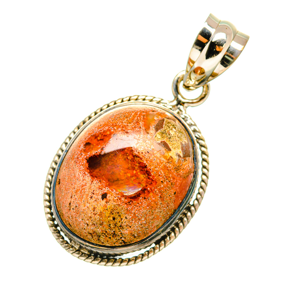 Fire Opal with sterling silver selling pendant. 1/2”